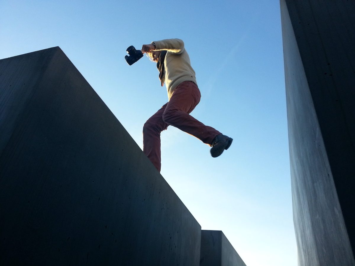 man jump on gray surface